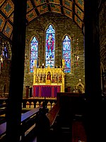 High altar with purple altar frontal marking the ecclesial season of Advent