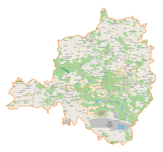 Mapa konturowa powiatu bełchatowskiego, w centrum znajduje się punkt z opisem „Szczerców”