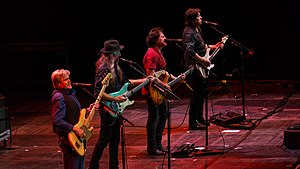 The Doobie Brothers performing in 2017. From left: touring member John Cowan, Patrick Simmons, Tom Johnston, and John McFee.