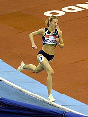 An example of Keely Hodgkinson's track and field uniform which exposes her midriff and belly button while running at the Birmingham Indoor Grand Prix in 2022