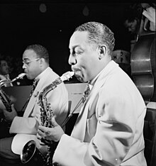 Hodges playing a Conn 6M with Al Sears in background, 1946