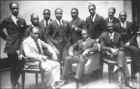 1925 photo taken at the Vox Phonograph Studio — Sam Wooding and his Orchestra; Seated, left to right: Tommy Ladnier (trumpet), John Warren (tuba) (behind), Sam Wooding (piano/leader), Willie Lewis (reeds), George Howe (1892–1936) (drums). Standing, left to right: Herb Flemming (trombone), Eugene Sedric (reeds), Johnny Mitchell (banjo), Bobby Martin (trumpet), Garvin Bushell (reeds), Maceo Elmer Edwards (1900–1988) (trumpet).[3] Not pictured: Arthur Lange (1889–1956), Arthur Johnston (1898–1954), arrangers