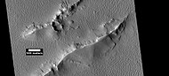 Layers and dark slope streaks in Lycus Sulci, as seen by HiRISE under HiWish program