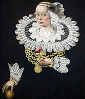 A seventeenth-century painting of a woman wearing a ruff, the decorative collar from which the English name of the bird derives. She is wearing a black dress with a particularly large and elaborate white lacy ruff, and holds a flower in her left hand.