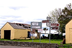 Loop Head Peninsula - Carrigaholt - Bridge Street - Derelict Building ^ Road Signs - geograph.org.uk - 3122893.jpg