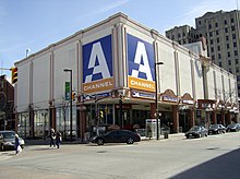 A three-story downtown building with large signage featuring the mid-2000s A-Channel logo