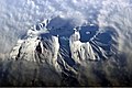 Astronaut photograph highlighting the summit crater and snow-covered slopes of the Avachinsky.