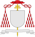 External ornaments of a cardinal's coat of arms, incorporating a scarlet galero with fifteen scarlet tassels on each side and a patriarchal cross behind the escutcheon and the motto