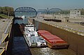 Towboat Steel Trader departing auxiliary lock at McAlpine Locks, 1987