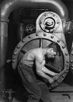 Power house mechanic working on steam pump