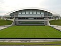 Retractable grass field shown outside the stadium