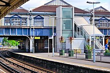 Lifts connecting a railway platform with a footbridge above