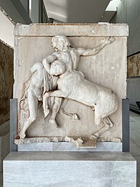 Recently removed metope from the Parthenon, depicts a Centaur and Lapith in battle.