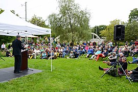 Thomas King reading in the Sculpture Garden