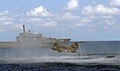 A RSN Chinook deploys a rescue diver and a raft near RSS Endeavour on 23 August 2010.