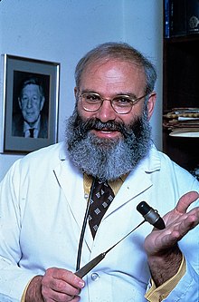 A grey-haired Oliver Sacks with glasses and a beard