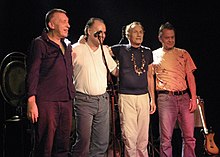 Zleva: Hans Reffert, Peter Kühmstedt, Mani Neumeier, Roland Schaeffer v roce 2007