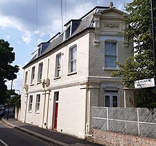 A corner house with end pediment and swag, Church Path