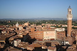 View of downtown Piazza del Campo (Campo Square), with the Mangia Tower (Torre del Mangia) and Santa Maria Church