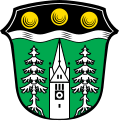 Gemeinde Wald Unter einem durch einen silbernen Wellenbalken unterstützten schwarzen Schildhaupt, darin nebeneinander drei goldene Kugeln, in Grün zwischen zwei bewurzelten silbernen Tannen ein wachsender silberner Kirchturm.