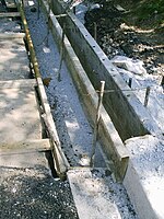 Metal forms before the concrete is poured and finished by hand