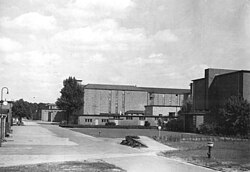 A open area with a large building structure in the background