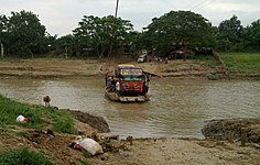 Rakit digunakan untuk menghantar kenderaan di Sungai Citarum, Karawang, Jawa Barat, Indonesia.