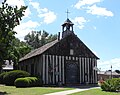 Église de la Sainte-Famille de Cahokia (1699), un des plus anciens témoignages d'architecture religieuse et illustration de la technique de poteau sur sole.