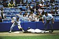 Image 3Rickey Henderson—the major leagues' all-time leader in runs and stolen bases—stealing third base in a 1988 game (from Baseball)