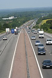 busy six lane highway crossing rural hilly landscape