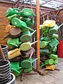 Watering cans on a stake in a school garden, Schooltuin Plutodreef Utrecht, the Netherlands