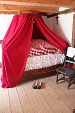 A simpler farmer's version, warm canopy apparently fasted to the ceiling-beams