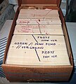 A box of punched cards with several program decks.