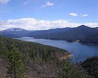 Long lake with short mountains in the background