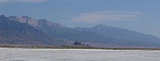 Flat expanse with a mountain range in the distance