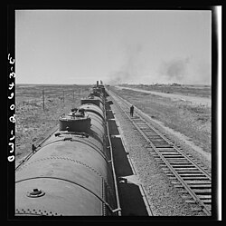 Santa Fe train stopping for water at Tolar, March 1943