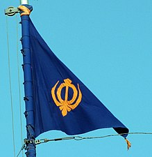 Sikh Nishan Sahib in blue, at Akali Phoola Singh di Burj in Amritsar