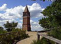 The red brick tower on the hill top.