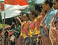 Image 90Timorese women with the Indonesian national flag (from History of Indonesia)