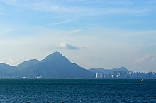 A view of Castle Peak from Tung Chung, showing the triangular shape of the hill (taken in 9 June 2011)(image by Malcolm Koo)