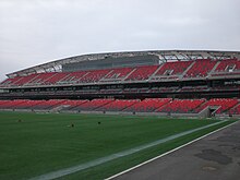 Photo of stadium grandstand with press box near the top