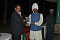 Malik Ata receiving medal from General Atif of Oman at Asian Beach Games 2010, Oman