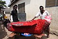 Ataa Oko and Kudjoe Affutu with Okos red rooster coffin 2009.