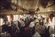 Rows of seats in a coach filled with passengers