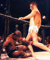 Image 1A "soccer kick", movement where the fighter kicks the head of a downed opponent. While common in vale tudo, early MMA and Japanese promotions, the soccer kick has been banned from the Unified Rules of Mixed Martial Arts. (from Mixed martial arts)