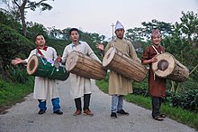 Young men playing the traditional chyabrung. Ilam, Nepal