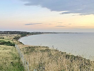 Waikato Point. Cliffs rise to about 30 m (98 ft) on the west coast of the lagoon