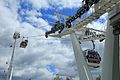 Image 17Gondolas of the Emirates Air Line cable car cross the River Thames from Greenwich Peninsula to Royal Docks.