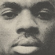 A grainy black & white image of Vince's face