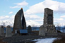 Color photo of two memorials made from stone located next to each other